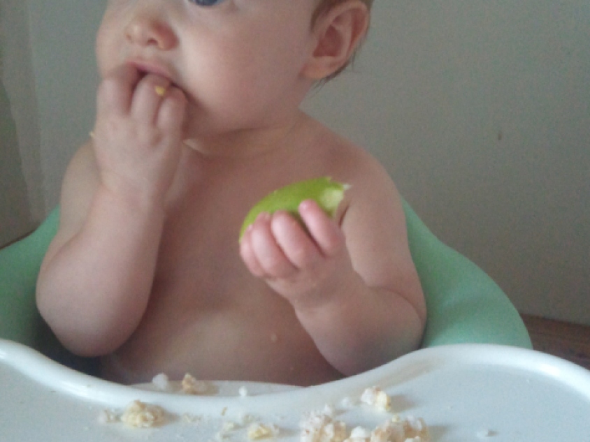Olive eating her apple